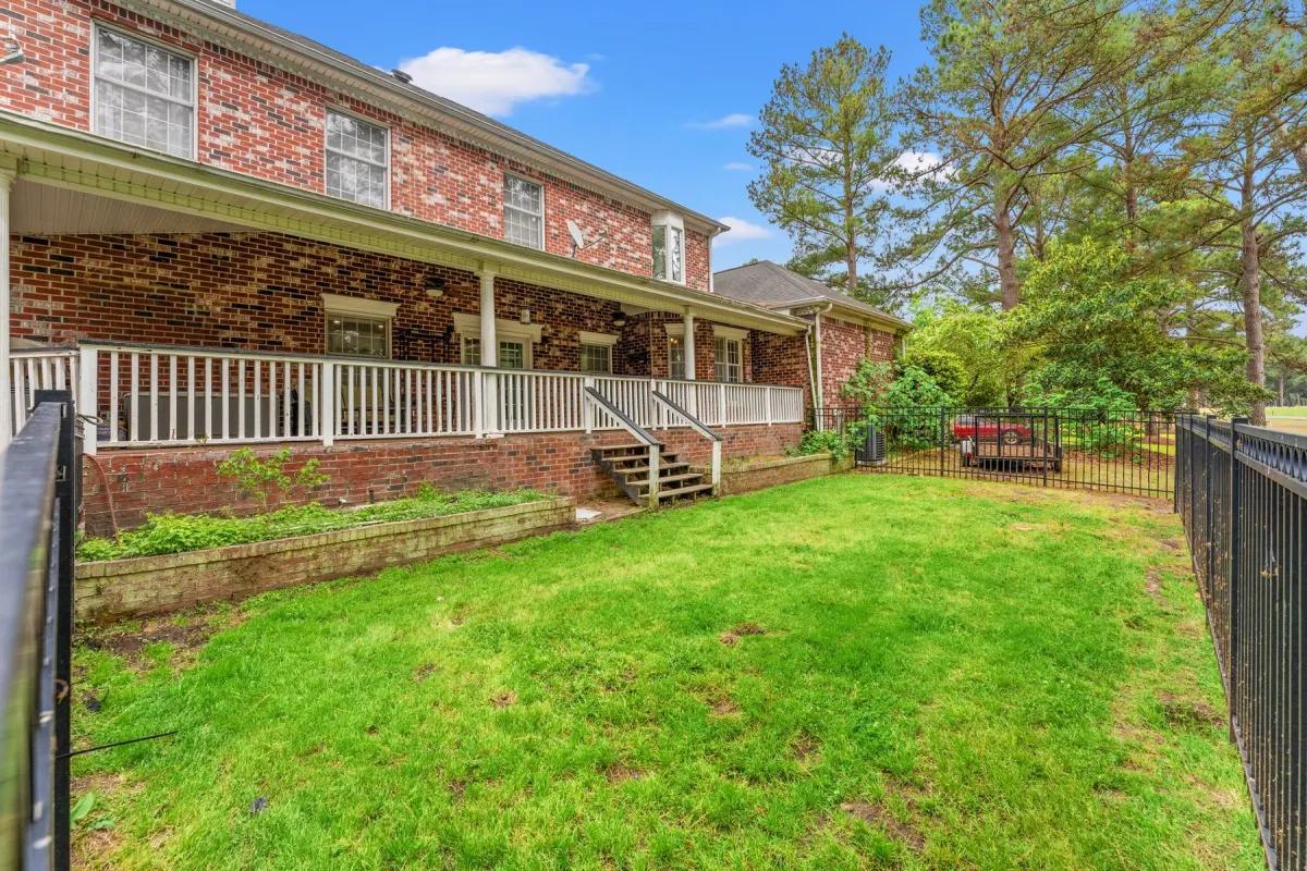 Fenced backyard with golf course setting